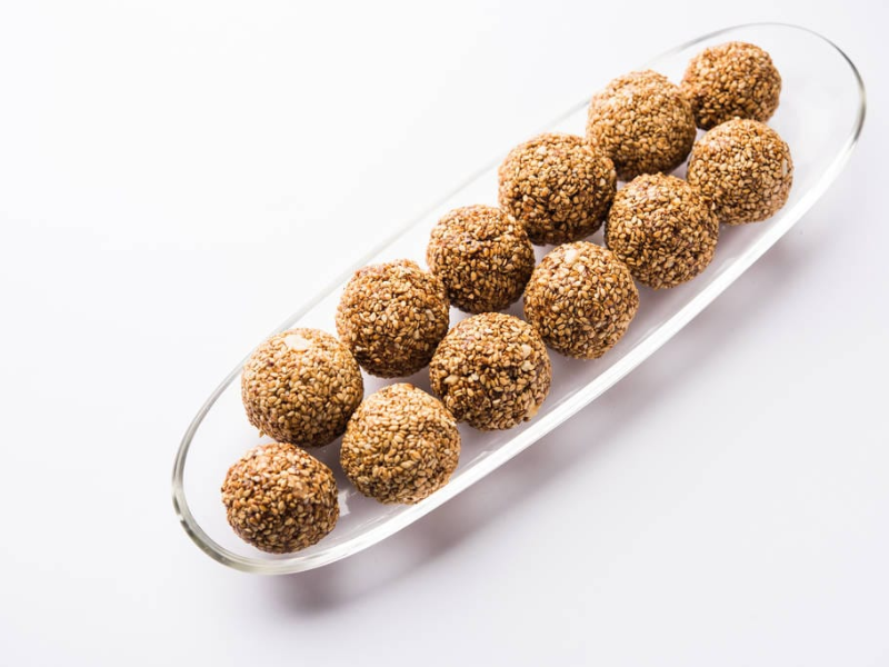 Manufacturer, Exporter, Importer, Supplier, Wholesaler, Retailer, Trader of Safad tilli laddoo in Kanpur, Uttar Pradesh, India.